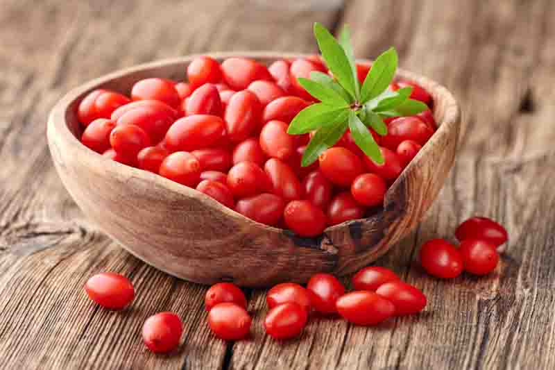 Goji berries on a wooden board