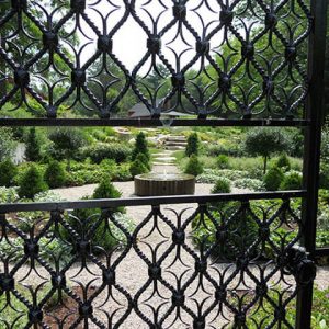 Garden ideas, Landscaping ideas, Parterre, Iron gate, flowering trees, boxwood, roses, perennials, low maintenance, Andrew Grossman Landscape