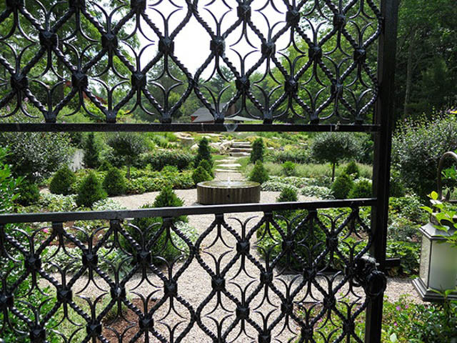 Garden ideas, Landscaping ideas, Parterre, Iron gate, flowering trees, boxwood, roses, perennials, low maintenance, Andrew Grossman Landscape